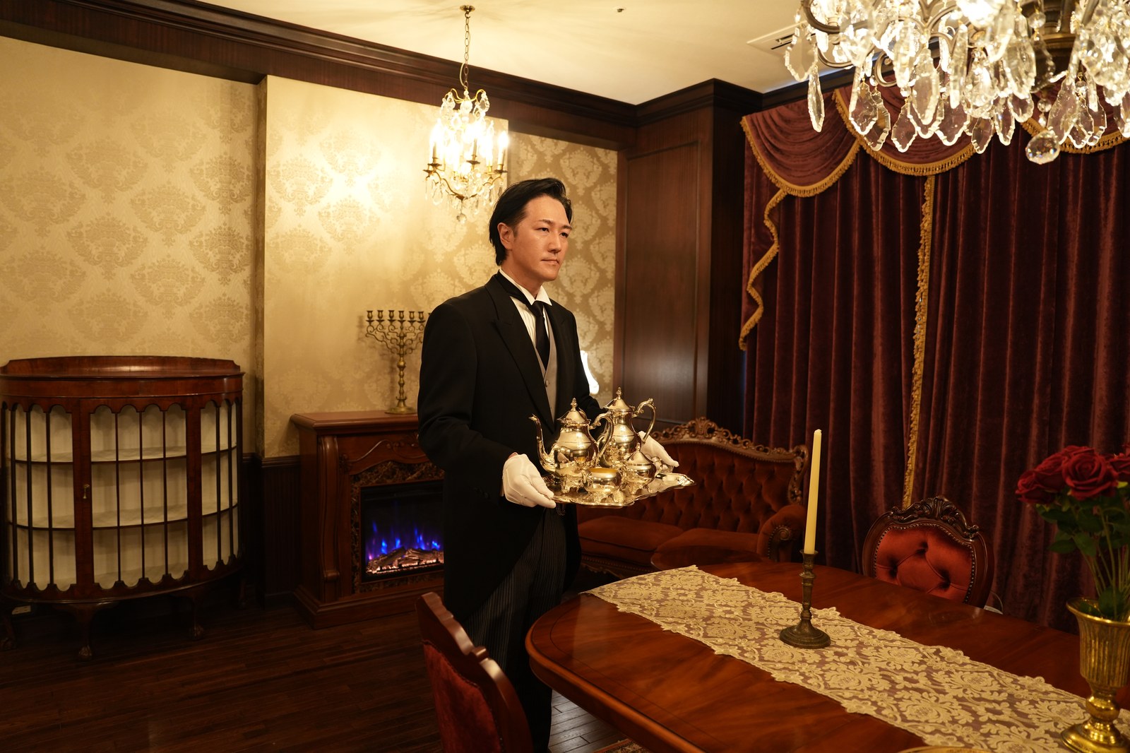 Butler Bell carrying a silver tea service (photograph from the Butler Bell site)