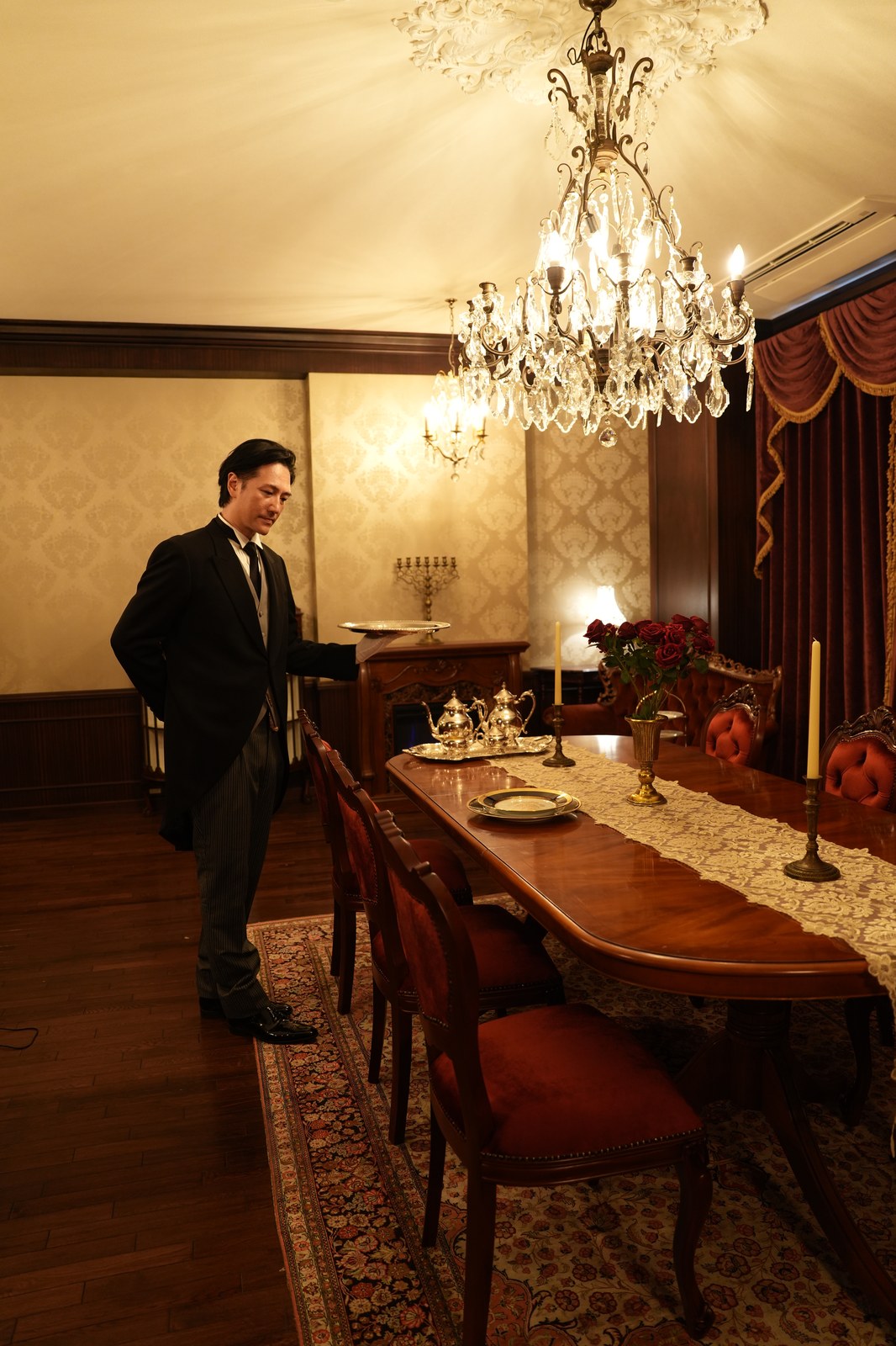 Butler Bell inspecting the dining room before service (photograph from the Butler Bell site)